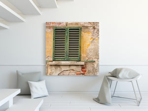 Tuscan architectural detail with green shutters and ochre wall