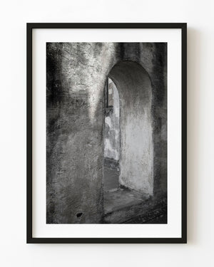 Weathered church archway in Havana photographed in black and white