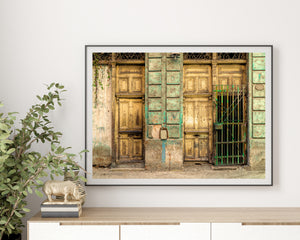 Colourful architectural detail of worn wooden doors in Havana