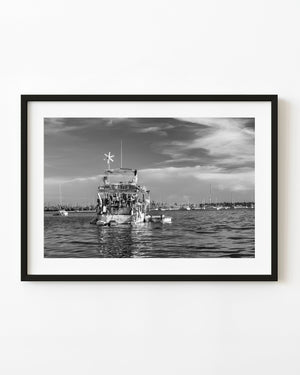 Weathered yacht stern at anchor in Key West, black and white