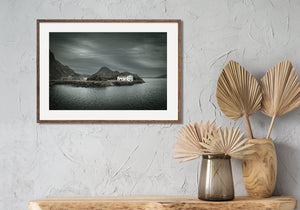 Weathered white facade and stone quay in Lofoten