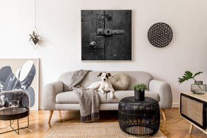 Worn ironwork and textured wood on an old London door