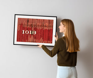 Weathered red railway carriage detail with vertical wooden planks