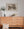 Romanian wooden door beside closed shutters on a timeworn wall