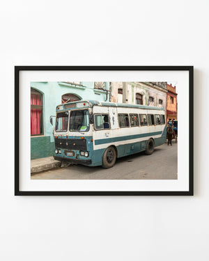 Weathered blue and white bus on a Santa Marta street in Cuba