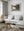 Weathered Northern Ontario home surrounded by trees and dry roadside grass