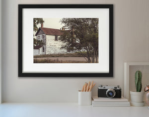 Colour photograph of an aged white wooden house in rural Ontario