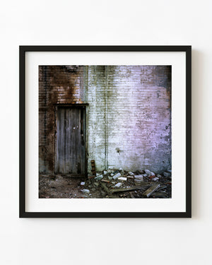 Weathered wooden door and peeling brick wall in Haliburton, Ontario