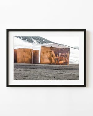 Rusted storage tanks against snow at Whalers Bay Antarctica
