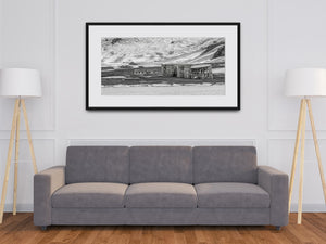 Derelict wooden structure beside old industrial tanks in Antarctica