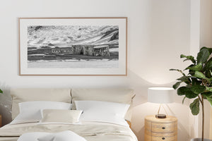 Weathered industrial tanks set against frozen volcanic terrain