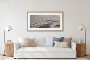 Point Pelee marsh photograph with rippled water and a distant curved path