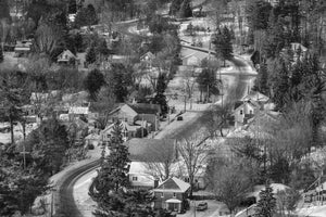 Winding snow-covered road through Haliburton Village