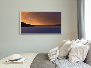 Haliburton winter landscape beneath glowing orange and purple clouds