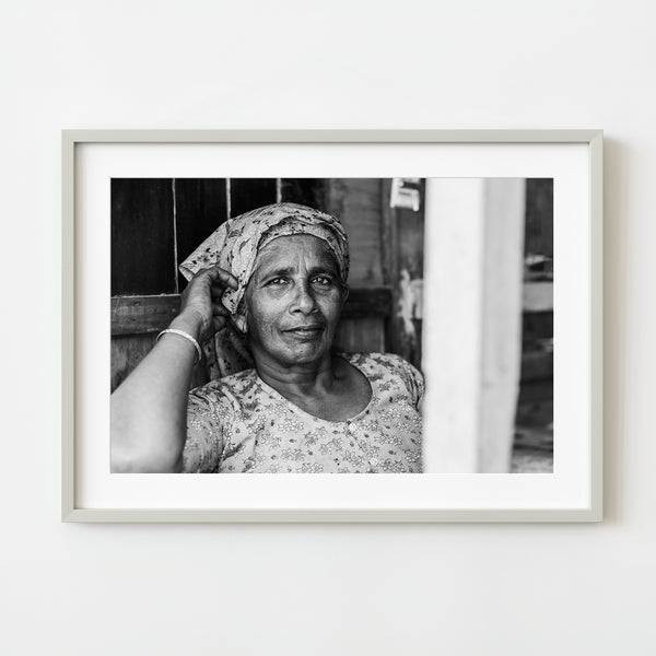 Woman resting in shop India portrait