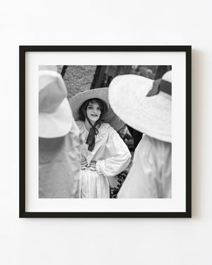 Woman in a wide straw hat in Tuscany photographed in black and white