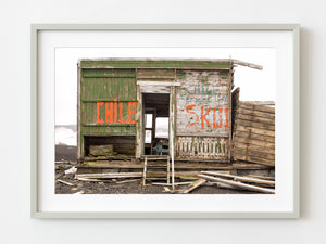 Wooden building with the word Chile at Whalers Bay Station Antarctica | Photo Art Print fine art photographic print