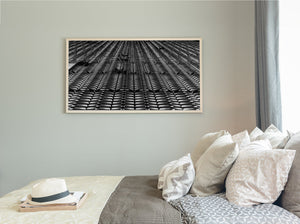 Repeating architectural panels with striped shadows and converging lines