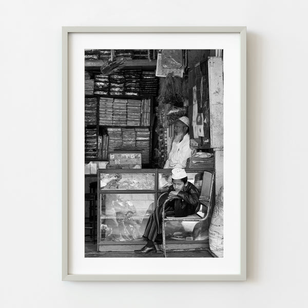 Young boy in Indian shop black and white