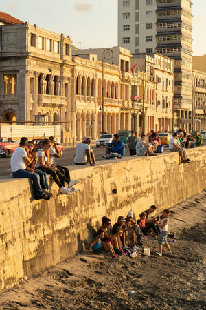 Street photography of Havana locals enjoying golden hour