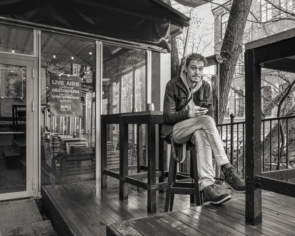 Young man sitting at café in Norway