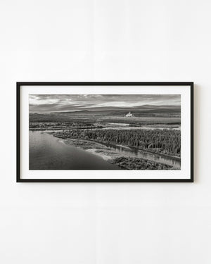Yukon River bend winding through northern forest in black and white