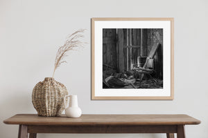 Ruined room with chair barrel and narrow bands of light
