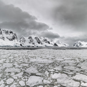 Antarctica mountain range beyond floating sea ice