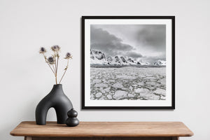 Square Antarctic landscape with ice-covered ocean foreground