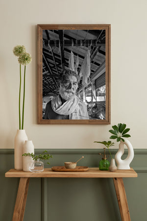 Indian street portrait of an elderly man surrounded by ropes and fabric
