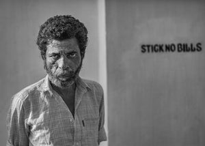 Bearded man staring directly into the camera in Kochi