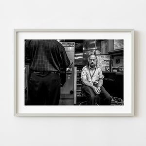 Black and white portrait of a Boston subway transit employee