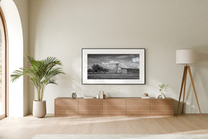 Monochrome landscape featuring grain elevator and freight train