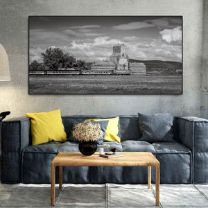 Chamberlain Saskatchewan grain elevator against cloudy prairie sky