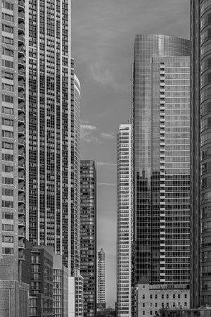 Vertical Chicago cityscape with modern glass and brick high-rise buildings