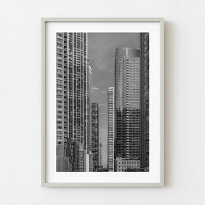 Black and white photograph of Chicago skyscrapers framing a distant tower