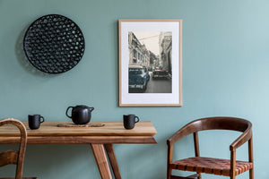 Historic Havana buildings surrounding classic cars and traffic
