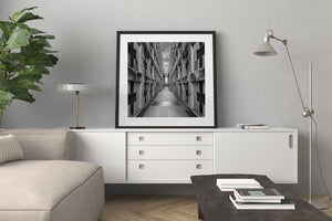 Black and white view of Faro a Colon monument hallway