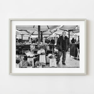 Elderly flower seller at a Zagreb market in black and white