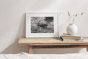 Black and white Nevada desert scene with abandoned ghost town building
