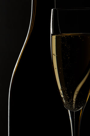 Abstract wine bottle and glass against deep black