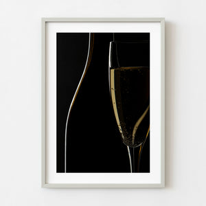 Dark wine bottle partly concealing a sparkling wine flute