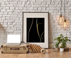 Golden sparkling wine visible behind a bottle silhouette