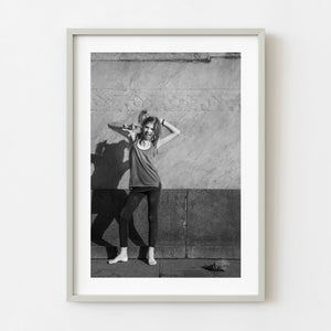 Young girl making a defiant gesture in Buenos Aires black and white street photography