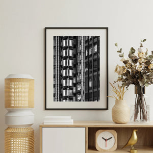 dramatic wall art with bold contrast and decisive light anchoring the room