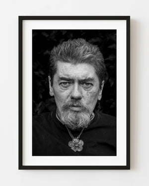 Black and white street portrait of a bearded man photographed in Dublin Ireland