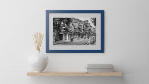 Weathered Hanoi storefronts and balconies in black and white