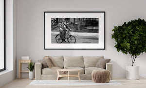 Bearded cyclist wearing reflective vest in black and white