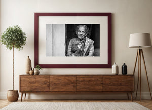 Black and white street portrait of an elderly Indian woman