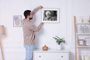 Older man looking toward the camera against a blurred background